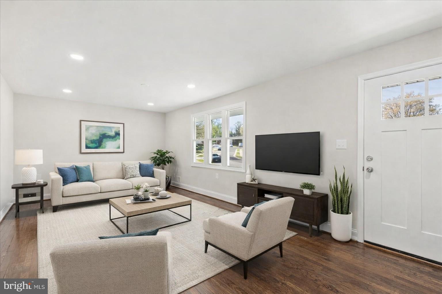 216 Cheddington Road Linthicum Heights, MD 21090 - Photo 2 of 60 a living room with furniture and a flat screen tv