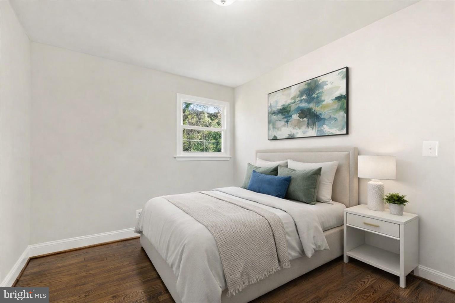 216 Cheddington Road Linthicum Heights, MD 21090 - Photo 4 of 60 a bedroom with a bed and a painting on the wall