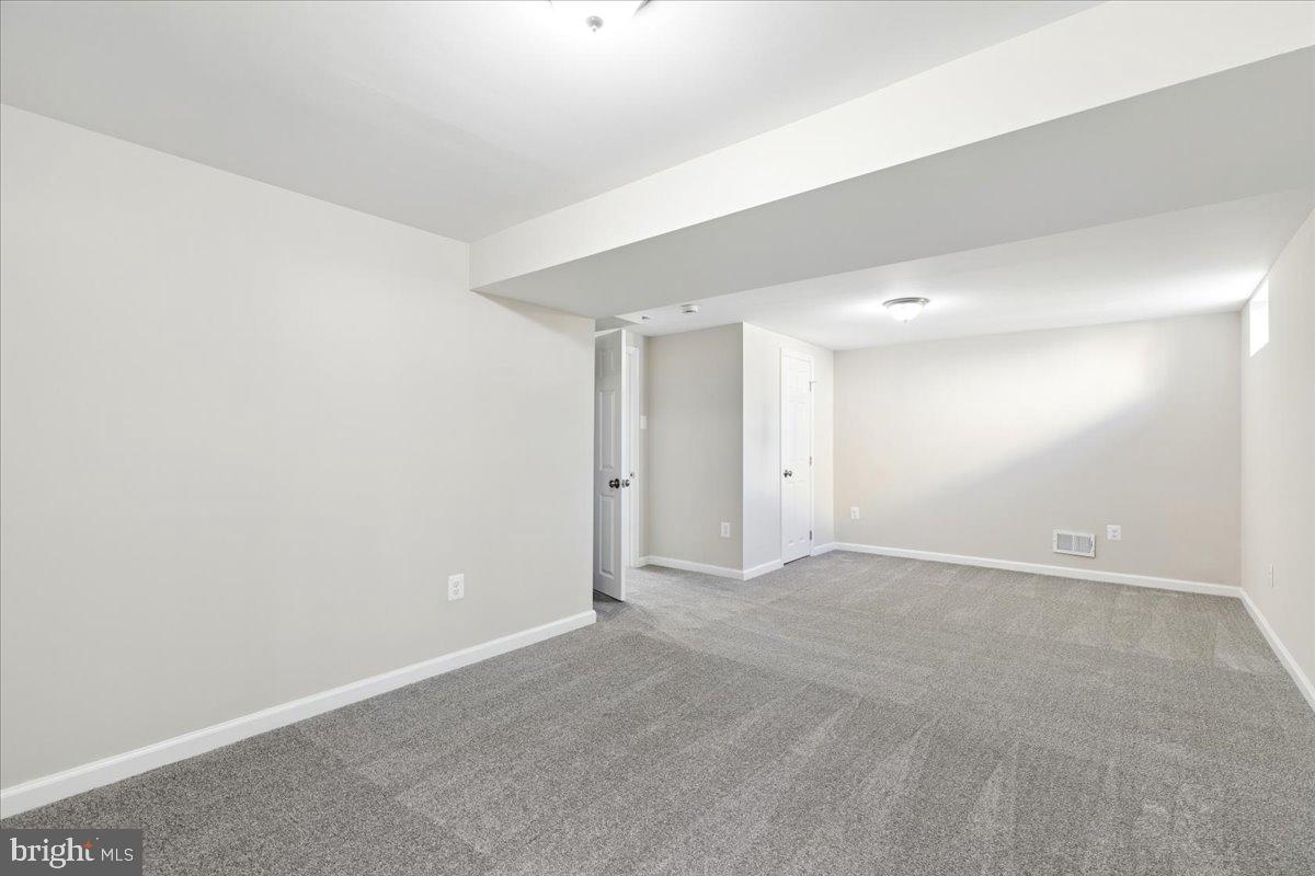 216 Cheddington Road Linthicum Heights, MD 21090 - Photo 44 of 60 a view of an empty room