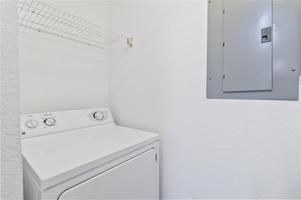 5459 Vineland Road, Unit 4208 Orlando, FL 32811 - Photo 24 of 29 a utility room with dryer and washer