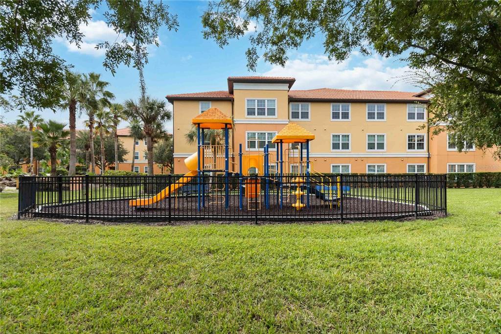 5459 Vineland Road, Unit 4208 Orlando, FL 32811 - Photo 27 of 29 a view of a house with a yard and sitting area