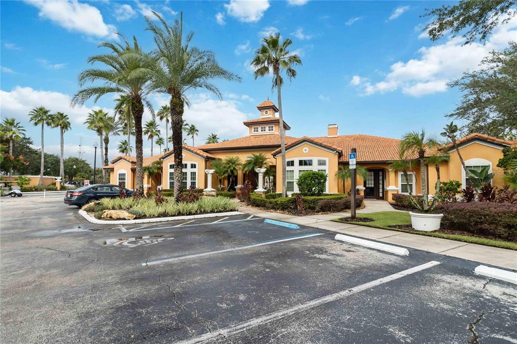 5459 Vineland Road, Unit 4208 Orlando, FL 32811 - Photo 28 of 29 a front view of a house with a garden and patio