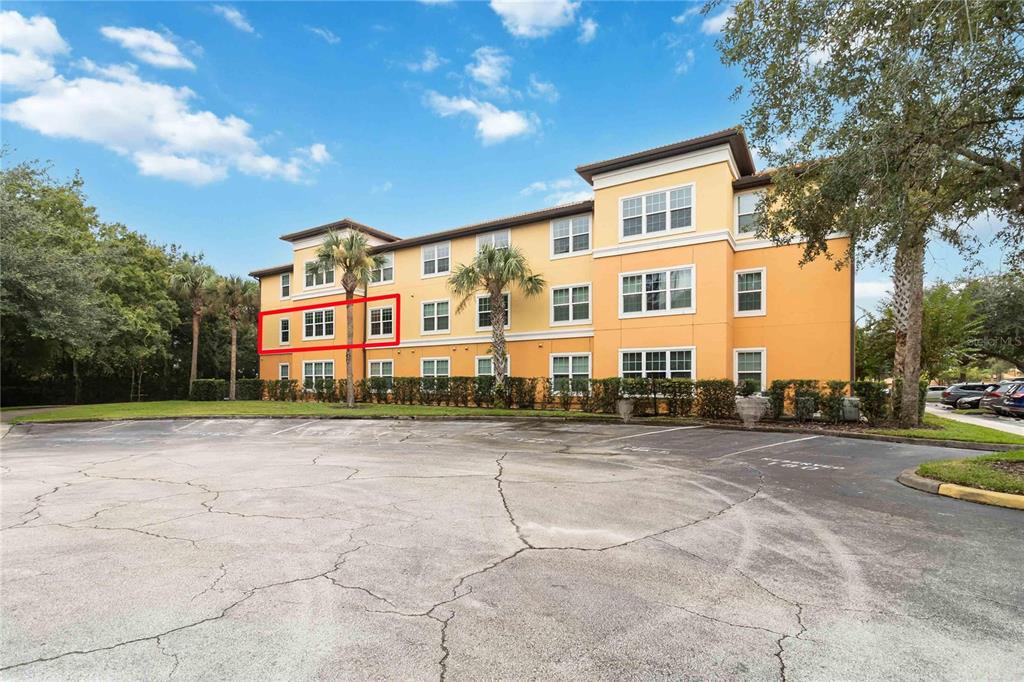 5459 Vineland Road, Unit 4208 Orlando, FL 32811 - Photo 3 of 29 a front view of a house with a yard