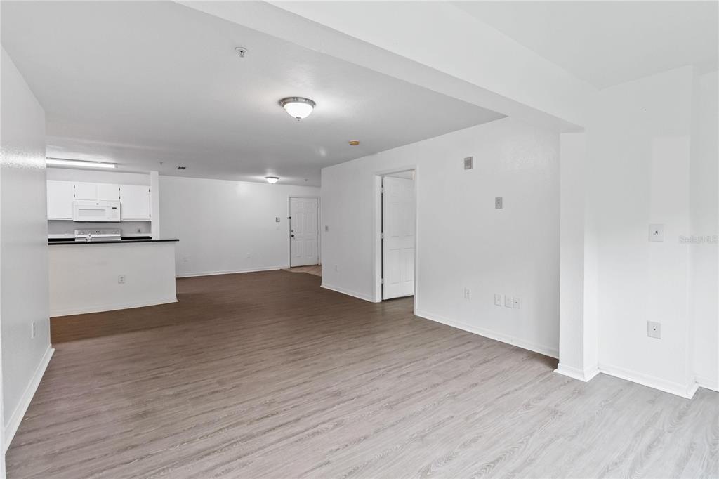 5459 Vineland Road, Unit 4208 Orlando, FL 32811 - Photo 5 of 29 a view of a kitchen with a sink and a stove top oven