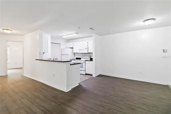 a view of kitchen with wooden floor