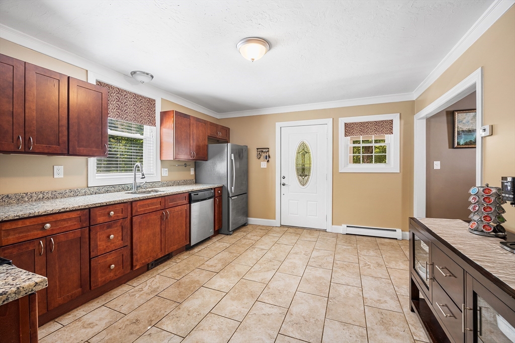 620 Whitney Street Gardner, MA 01440 - Photo 11 of 39 a kitchen with stainless steel appliances granite countertop a refrigerator and a sink