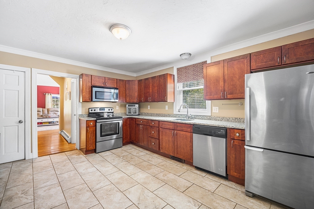 620 Whitney Street Gardner, MA 01440 - Photo 13 of 39 a kitchen with stainless steel appliances granite countertop a refrigerator sink and cabinets