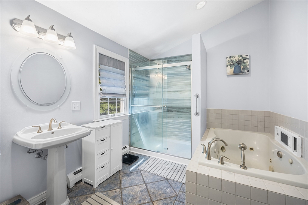 620 Whitney Street Gardner, MA 01440 - Photo 20 of 39 a bathroom with a sink a bathtub and a mirror