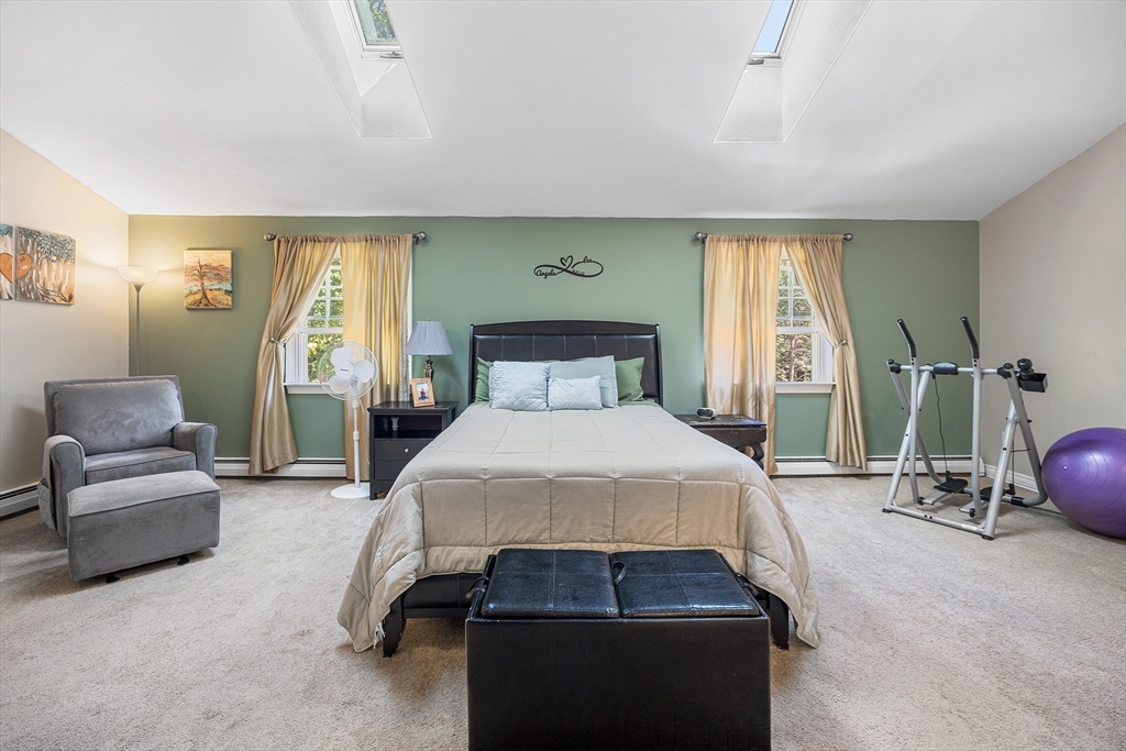 620 Whitney Street Gardner, MA 01440 - Photo 21 of 39 a bedroom with a bed and a couch