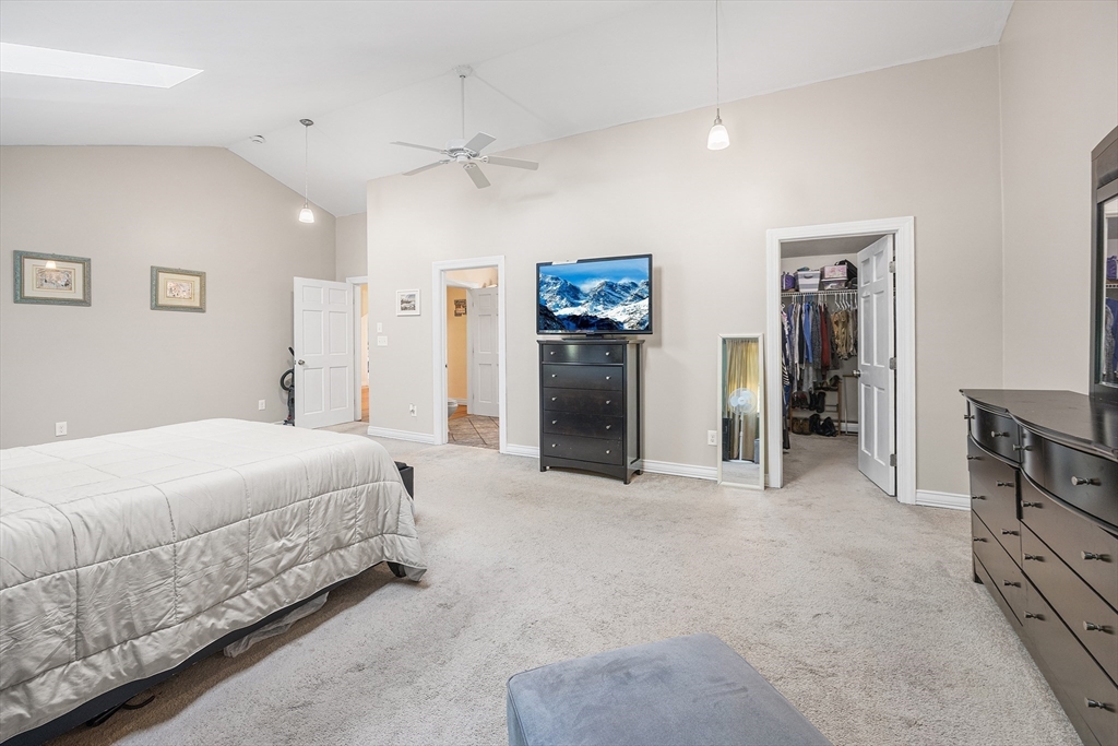 620 Whitney Street Gardner, MA 01440 - Photo 22 of 39 a spacious bedroom with a bed and a walk in closet