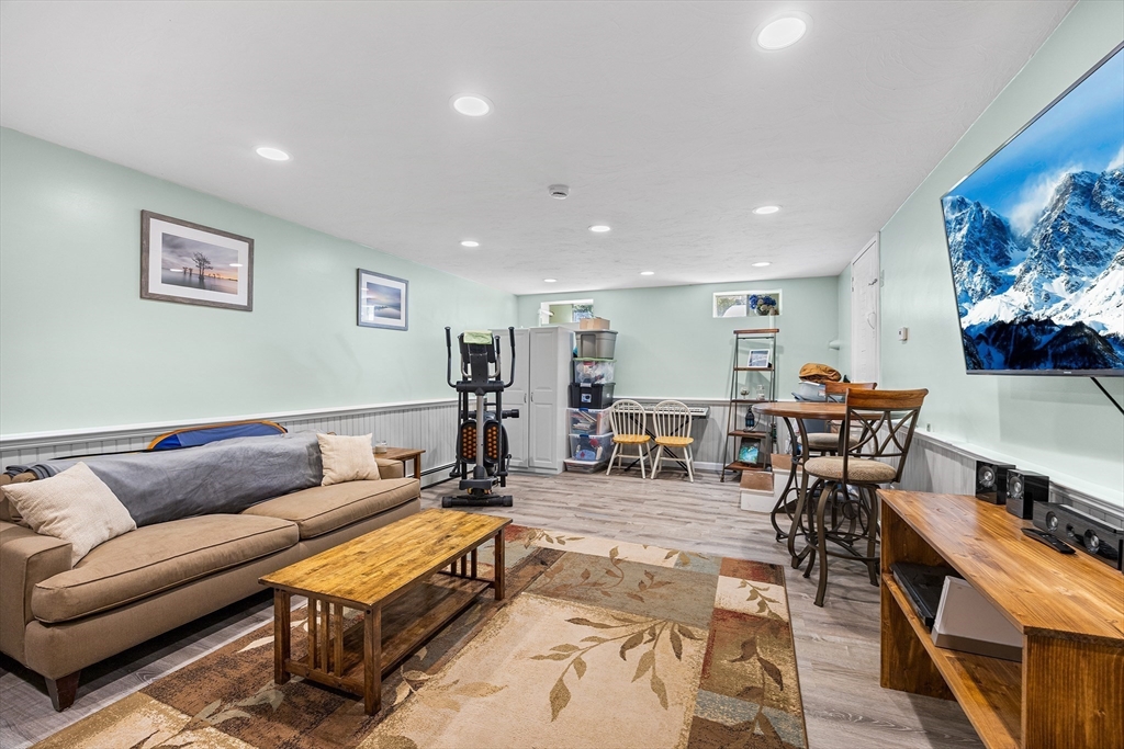 620 Whitney Street Gardner, MA 01440 - Photo 26 of 39 a living room with furniture and a flat screen tv