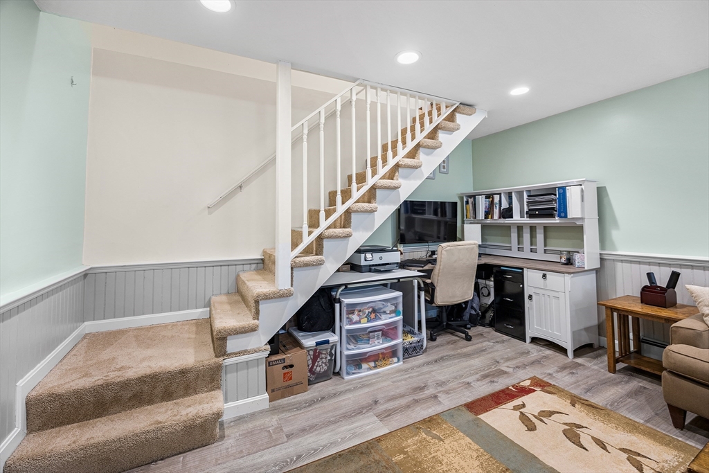 620 Whitney Street Gardner, MA 01440 - Photo 27 of 39 a living room with furniture and stairs