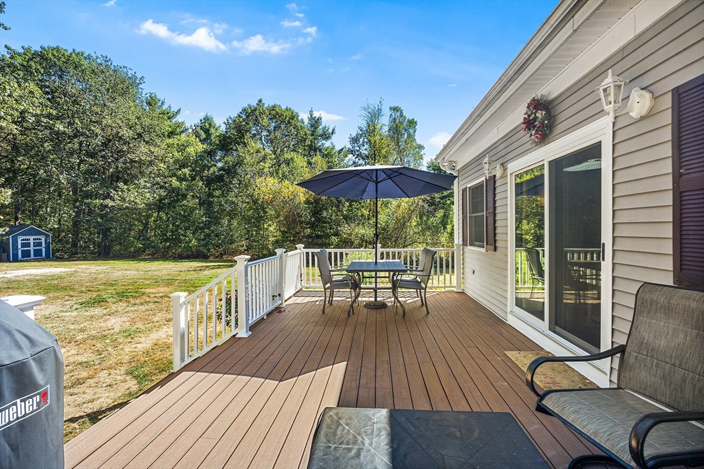 620 Whitney Street Gardner, MA 01440 - Photo 29 of 39 a view of balcony with chairs and wooden floor