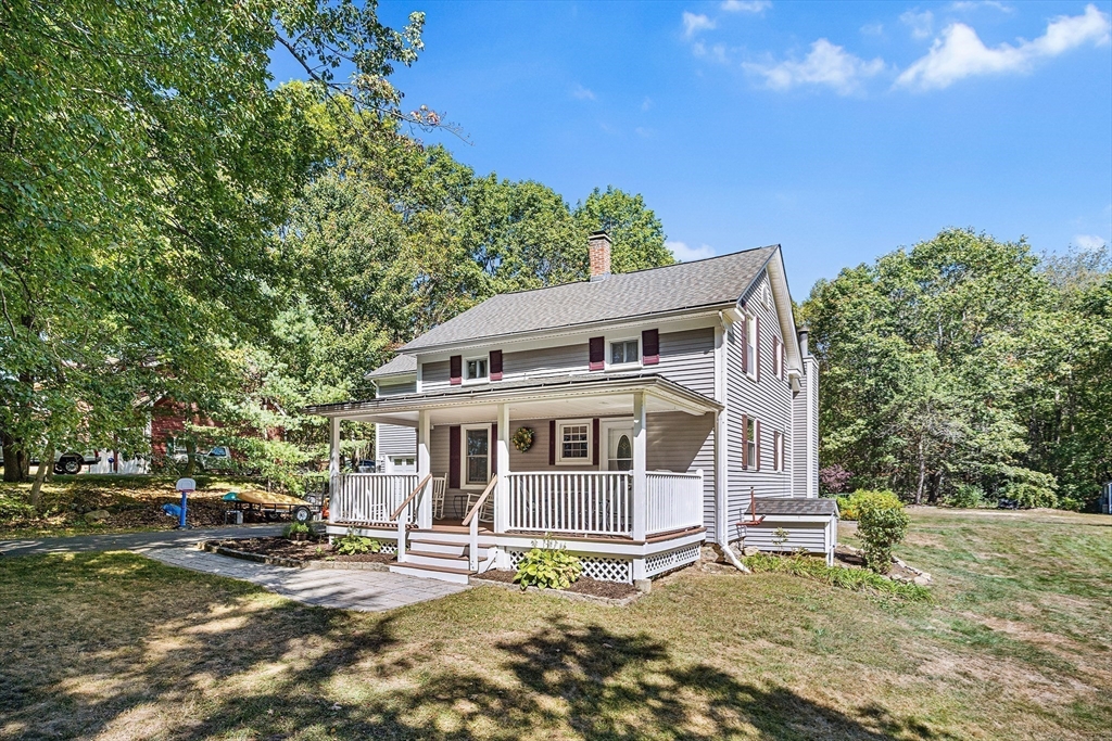 620 Whitney Street Gardner, MA 01440 - Photo 33 of 39 a view of a house with a large window and a yard