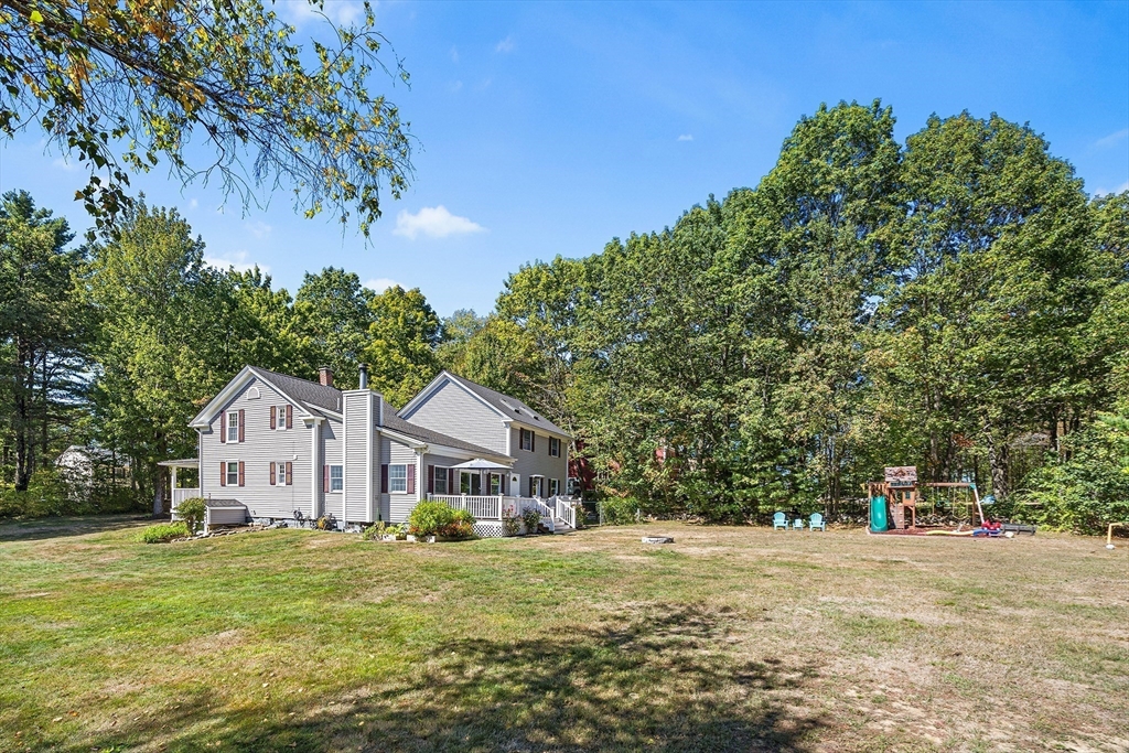 620 Whitney Street Gardner, MA 01440 - Photo 36 of 39 a front view of a house with a garden