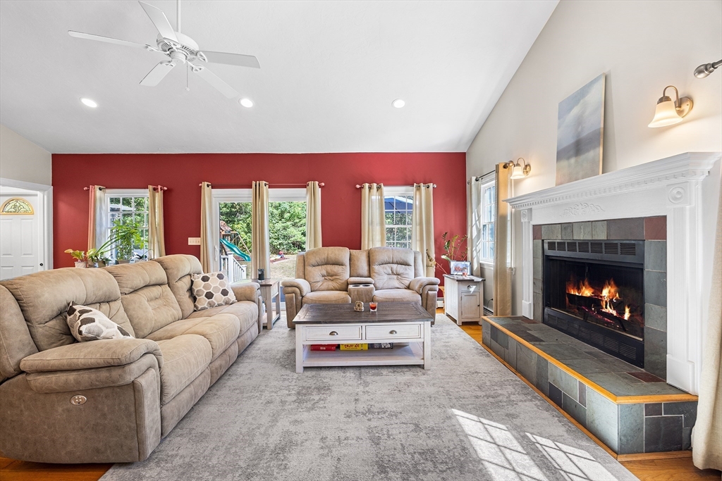 620 Whitney Street Gardner, MA 01440 - Photo 6 of 39 a living room with furniture and a fireplace
