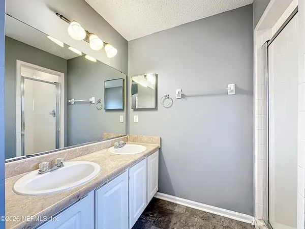 a white bath tub sitting next to a white sink