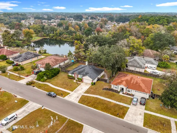 an aerial view of residential houses with outdoor space