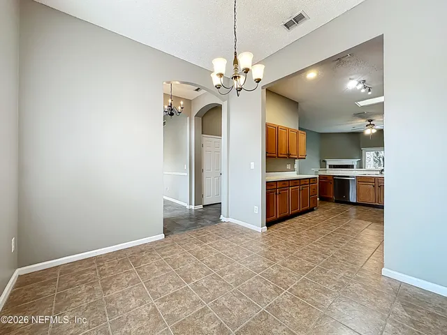 a view of a kitchen with a sink and a kitchen