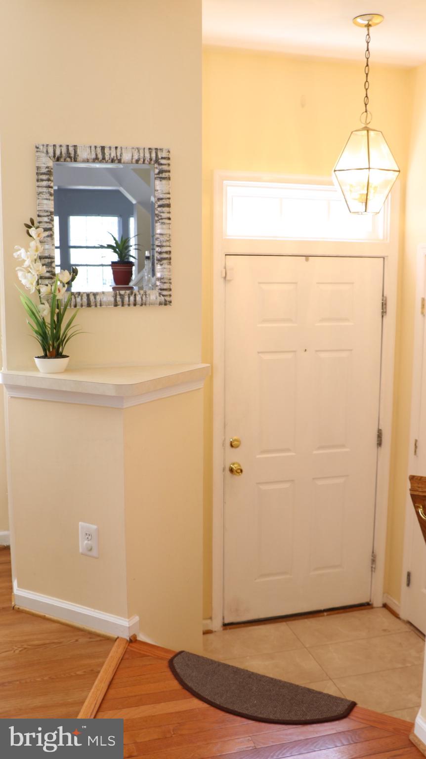 4048 Jasper Loop Dumfries, VA 22025 - Photo 3 of 29 Front entrance foyer with closet for jackets