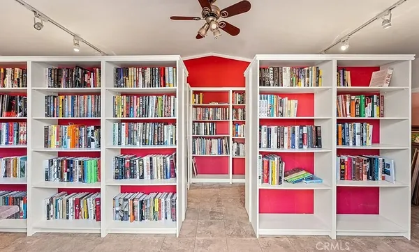 a book shelf in a room with a book shelf