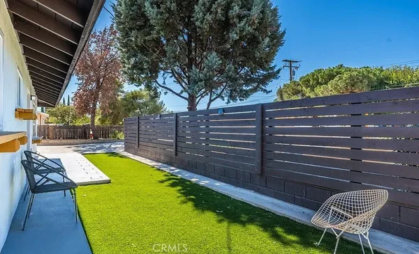 a view of a swimming pool with a lounge chairs