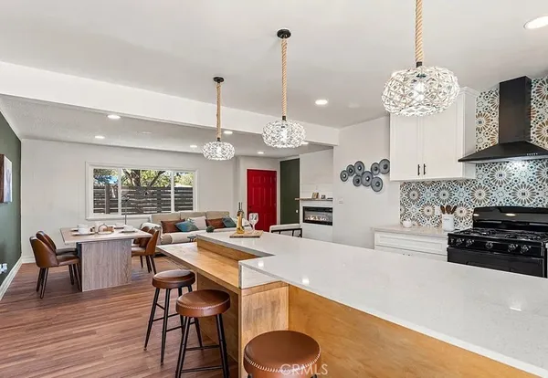 a kitchen with a table and chairs in it