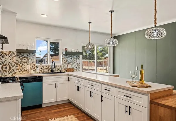 a kitchen with sink cabinets and window