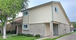 a view of house with a yard and an outdoor space