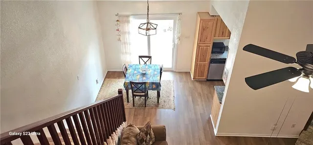 a view of dining room with furniture and wooden floor