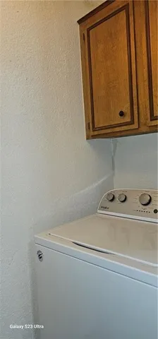 a view of a utility room with dryer and washer