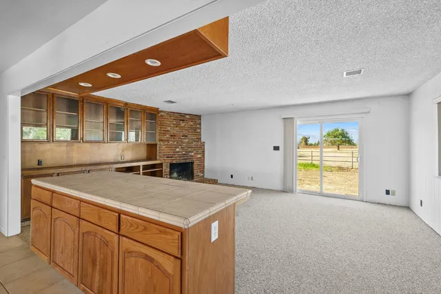 a kitchen with a sink and a window