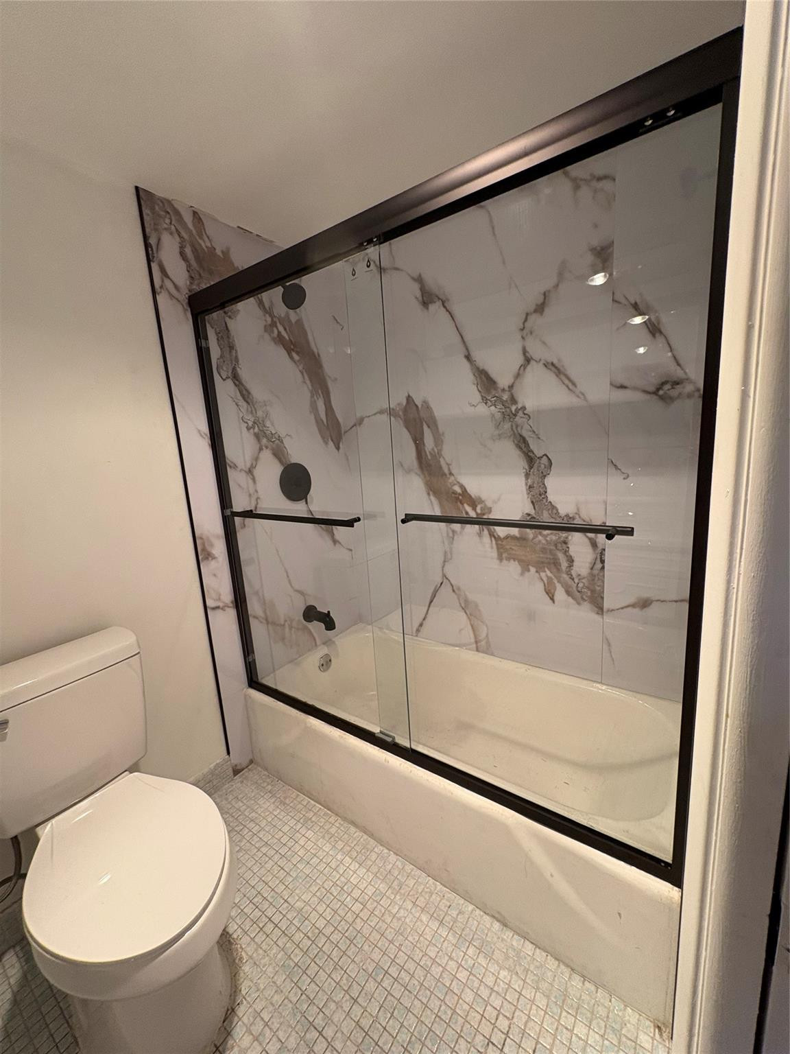 3150 North Course Lane, Unit 607 Pompano Beach, FL 33069 - Photo 15 of 16 a bathroom with a toilet and a shower