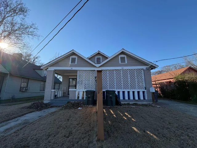 a view of a porch with furniture and a window