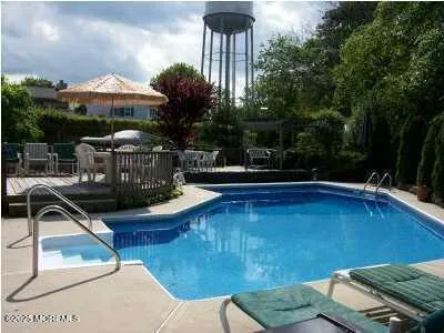a view of a backyard with sitting area