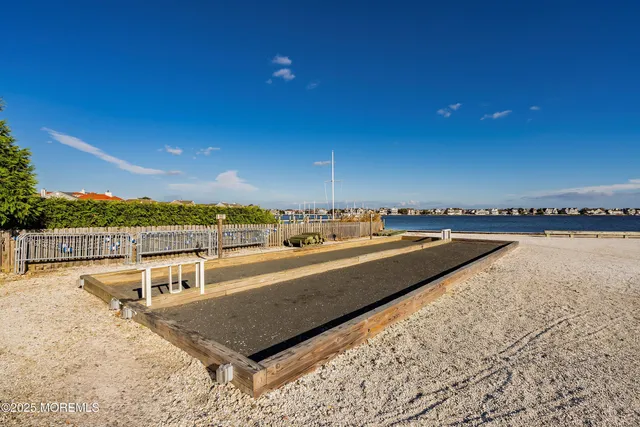 a view of a swimming pool and an outdoor seating