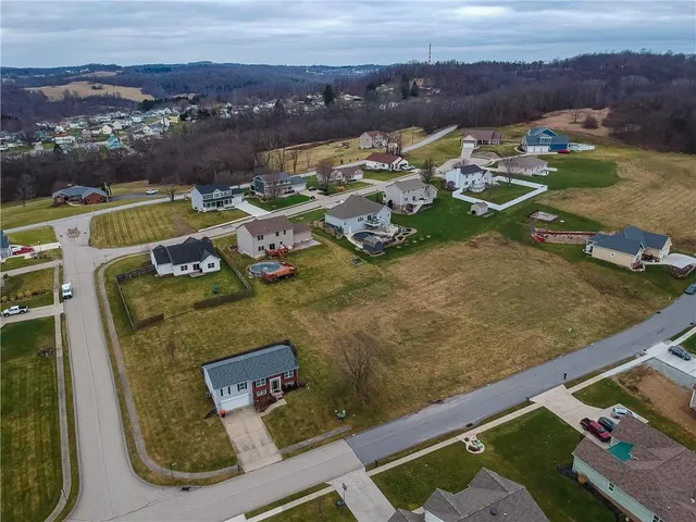an aerial view of a house with a ocean view