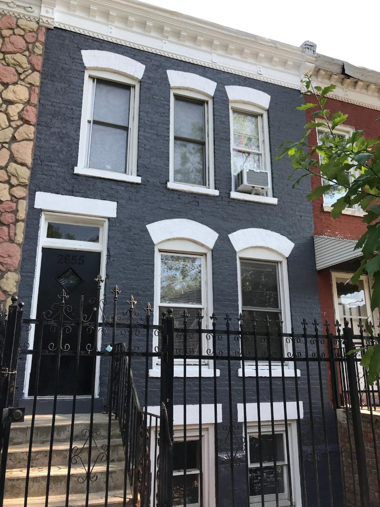 a front view of a house with glass windows