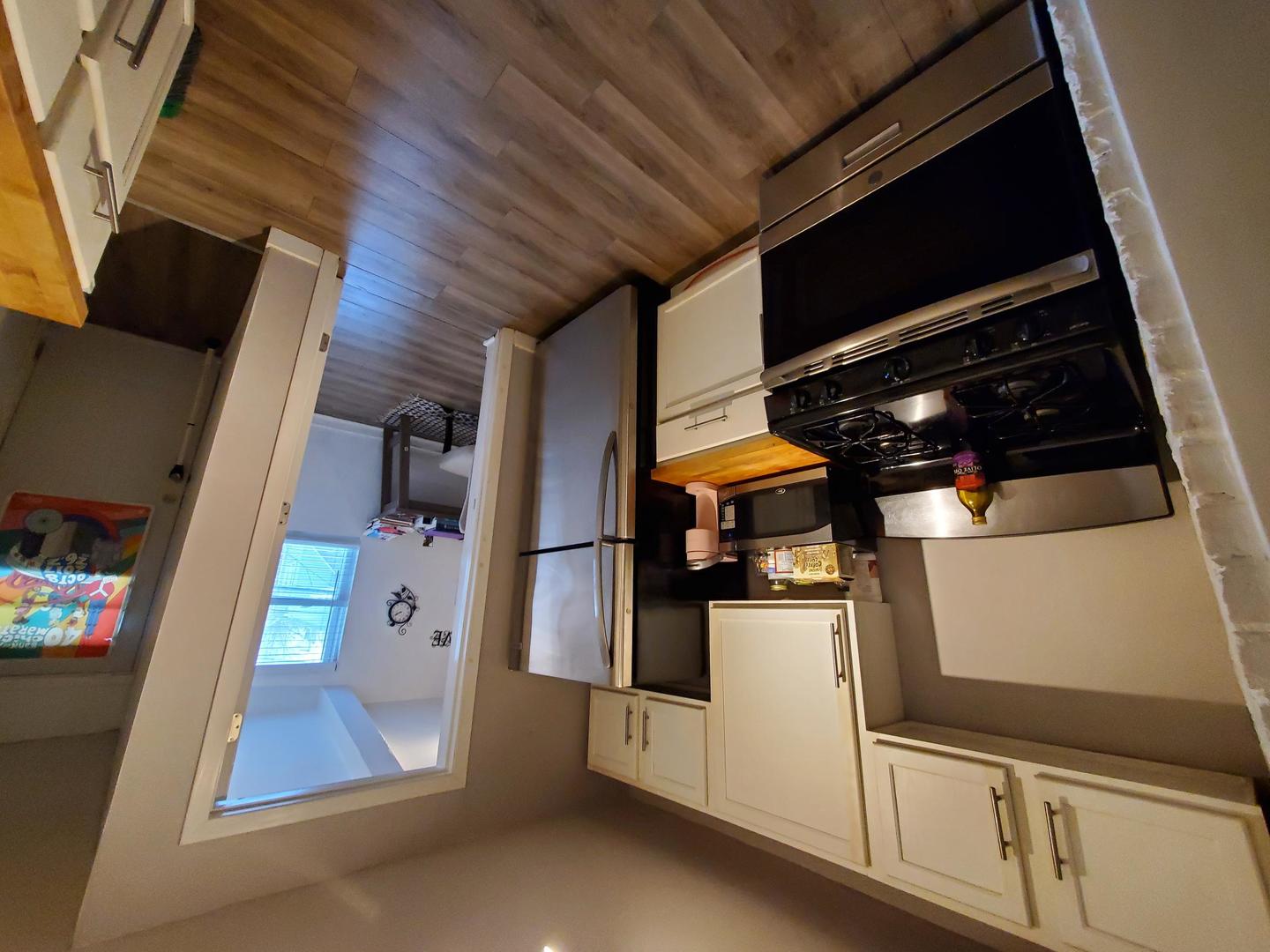 2655 West 24th Place Chicago, IL 60608 - Photo 11 of 16 a view of walk in closet with clothes and shoes