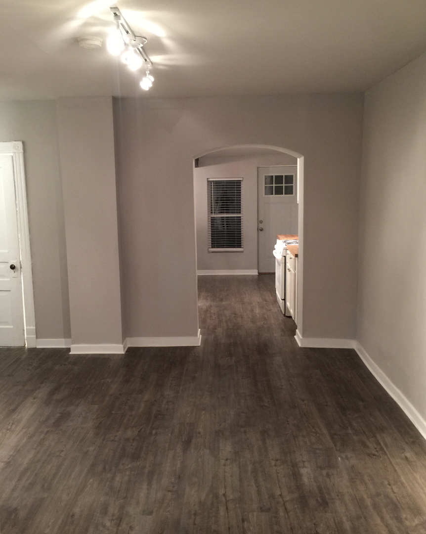 2655 West 24th Place Chicago, IL 60608 - Photo 7 of 16 a view of empty room with wooden floor