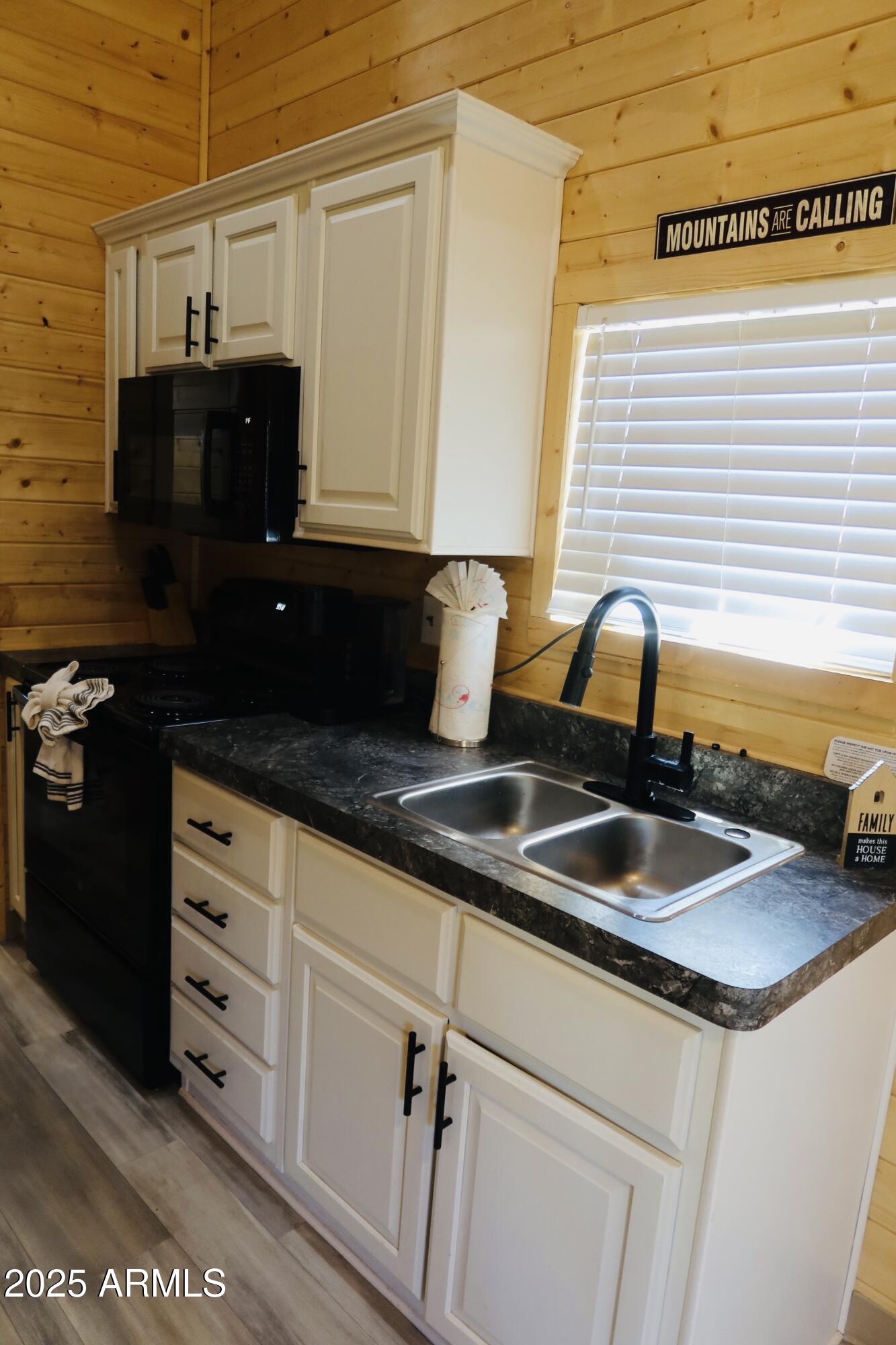 2746 Columbia Lane, Unit 10 Overgaard, AZ 85933 - Photo 16 of 33 a kitchen with granite countertop a sink and a stove