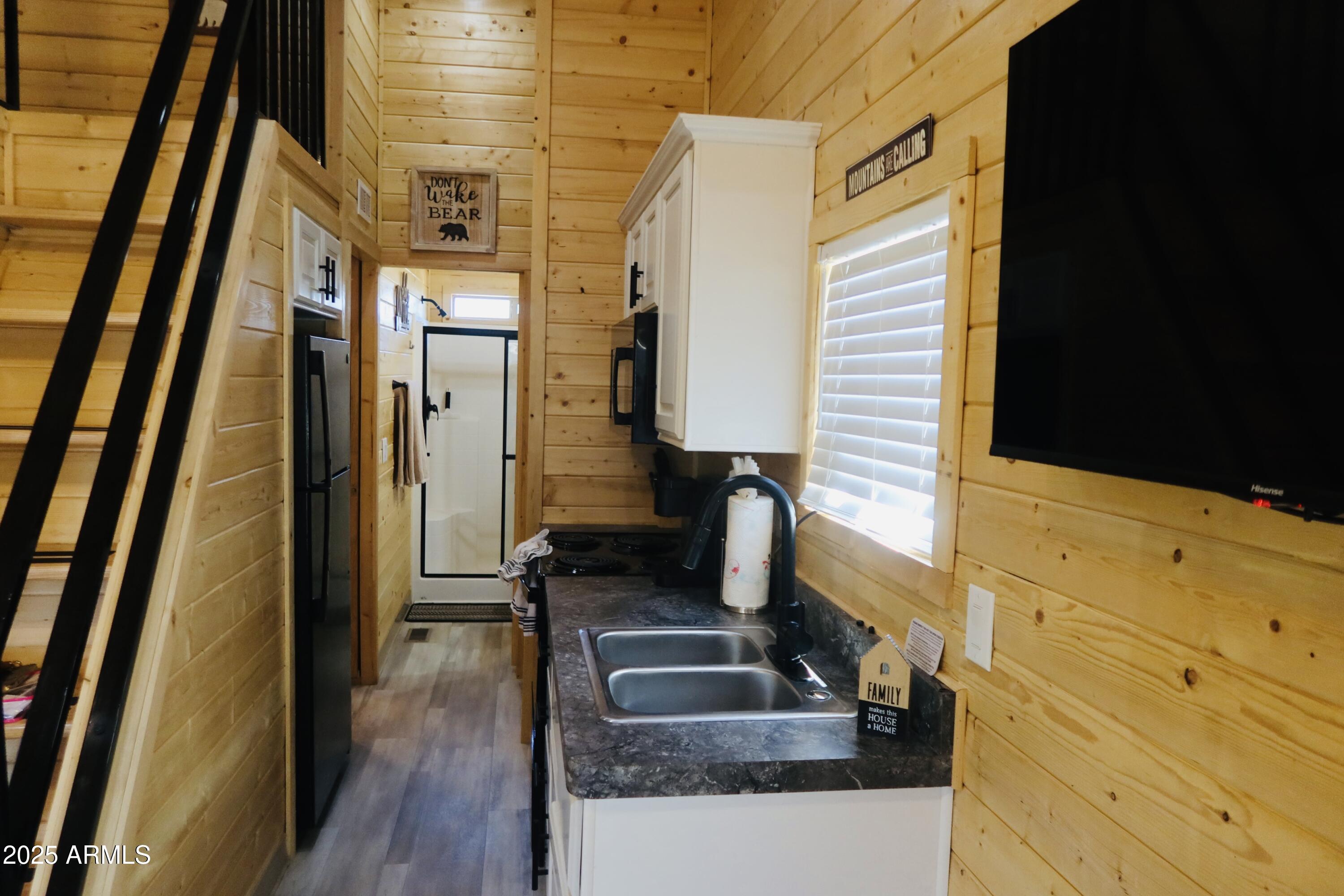 2746 Columbia Lane, Unit 10 Overgaard, AZ 85933 - Photo 18 of 33 a bathroom with a sink and a mirror