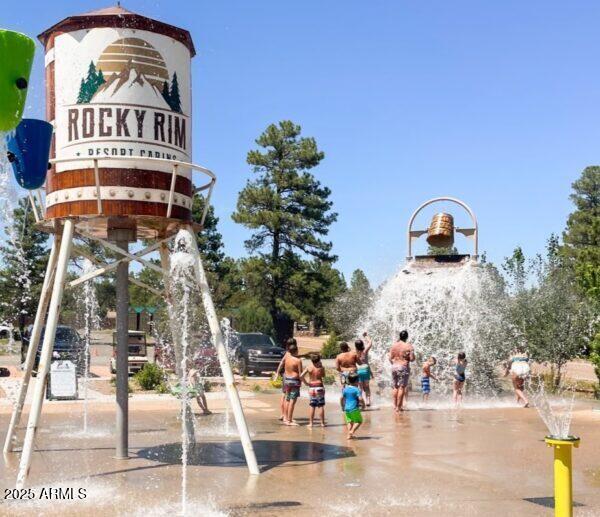 2746 Columbia Lane, Unit 10 Overgaard, AZ 85933 - Photo 2 of 33 a view of a tall building with a tree in front