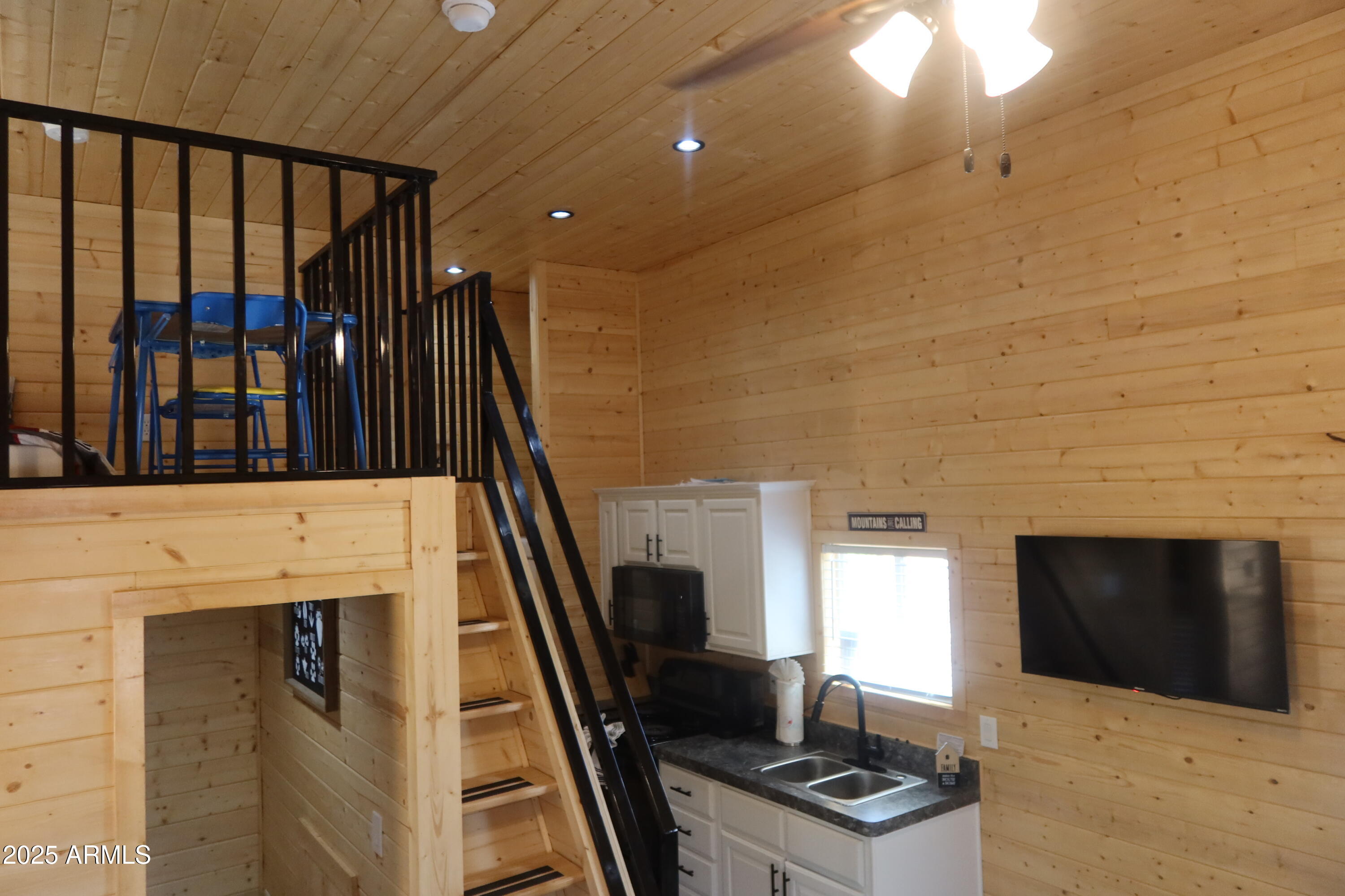 2746 Columbia Lane, Unit 10 Overgaard, AZ 85933 - Photo 21 of 33 a view of a livingroom with furniture and a fireplace