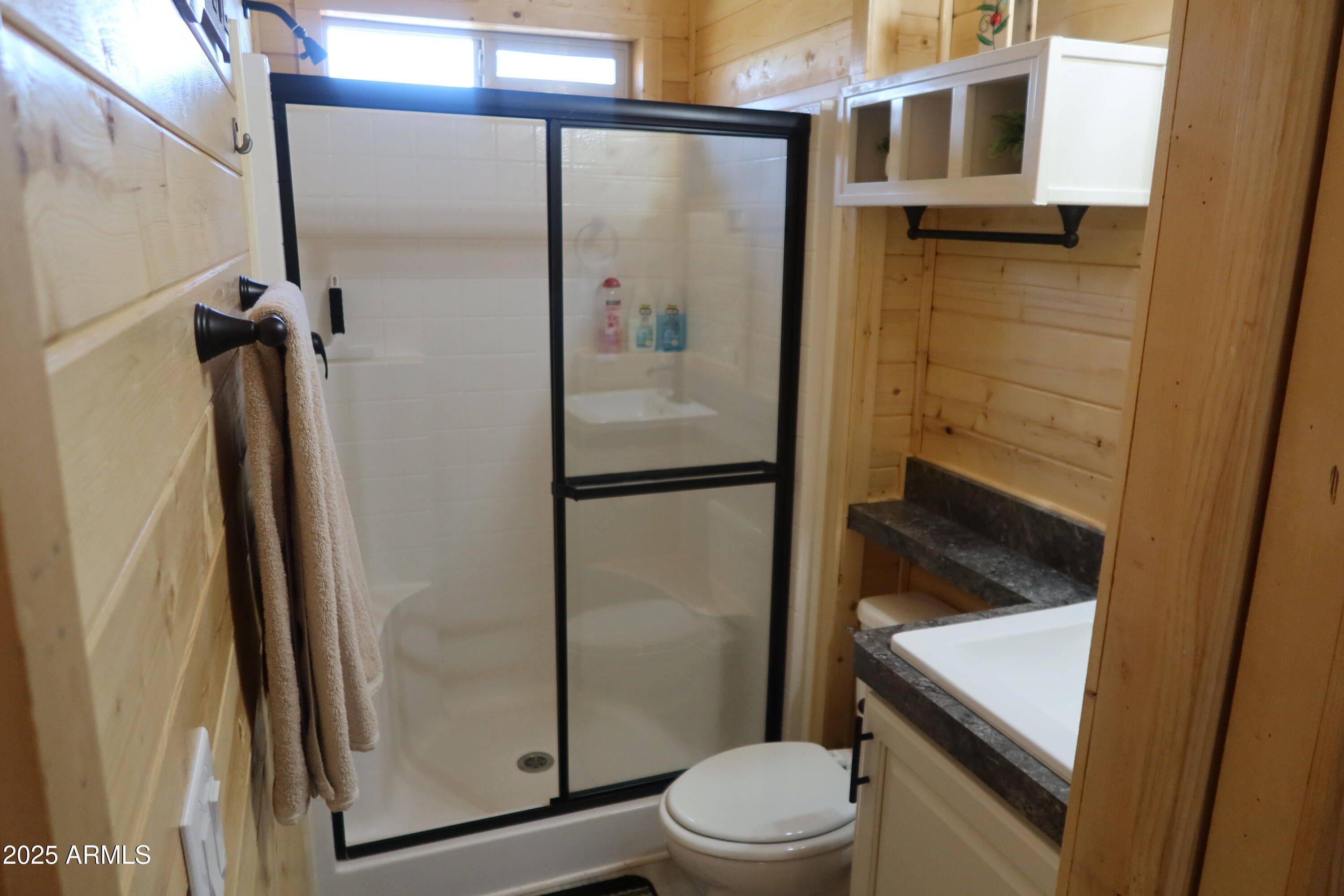 2746 Columbia Lane, Unit 10 Overgaard, AZ 85933 - Photo 25 of 33 a bathroom with a toilet a sink and shower