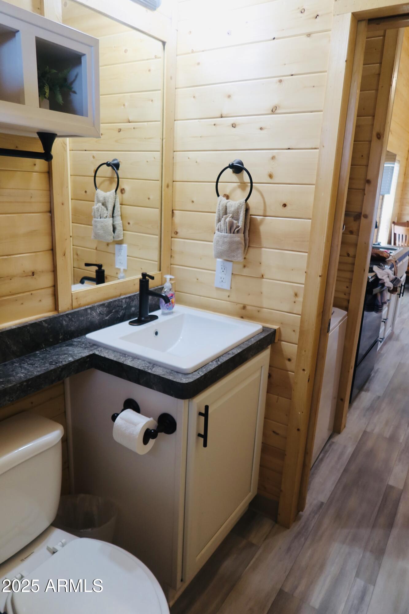 2746 Columbia Lane, Unit 10 Overgaard, AZ 85933 - Photo 26 of 33 a bathroom with a sink and a mirror