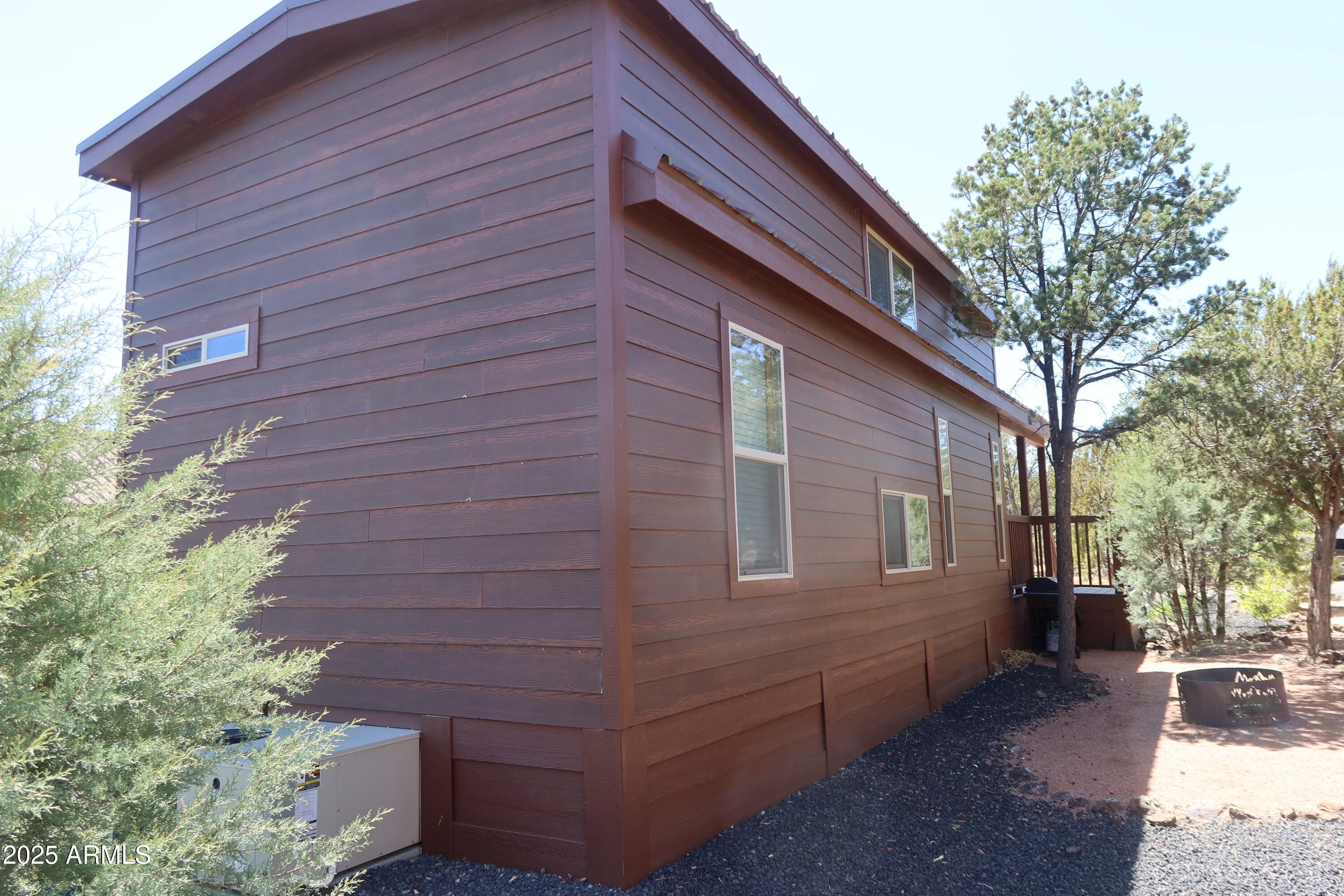 2746 Columbia Lane, Unit 10 Overgaard, AZ 85933 - Photo 28 of 33 a view of a backyard with a large tree