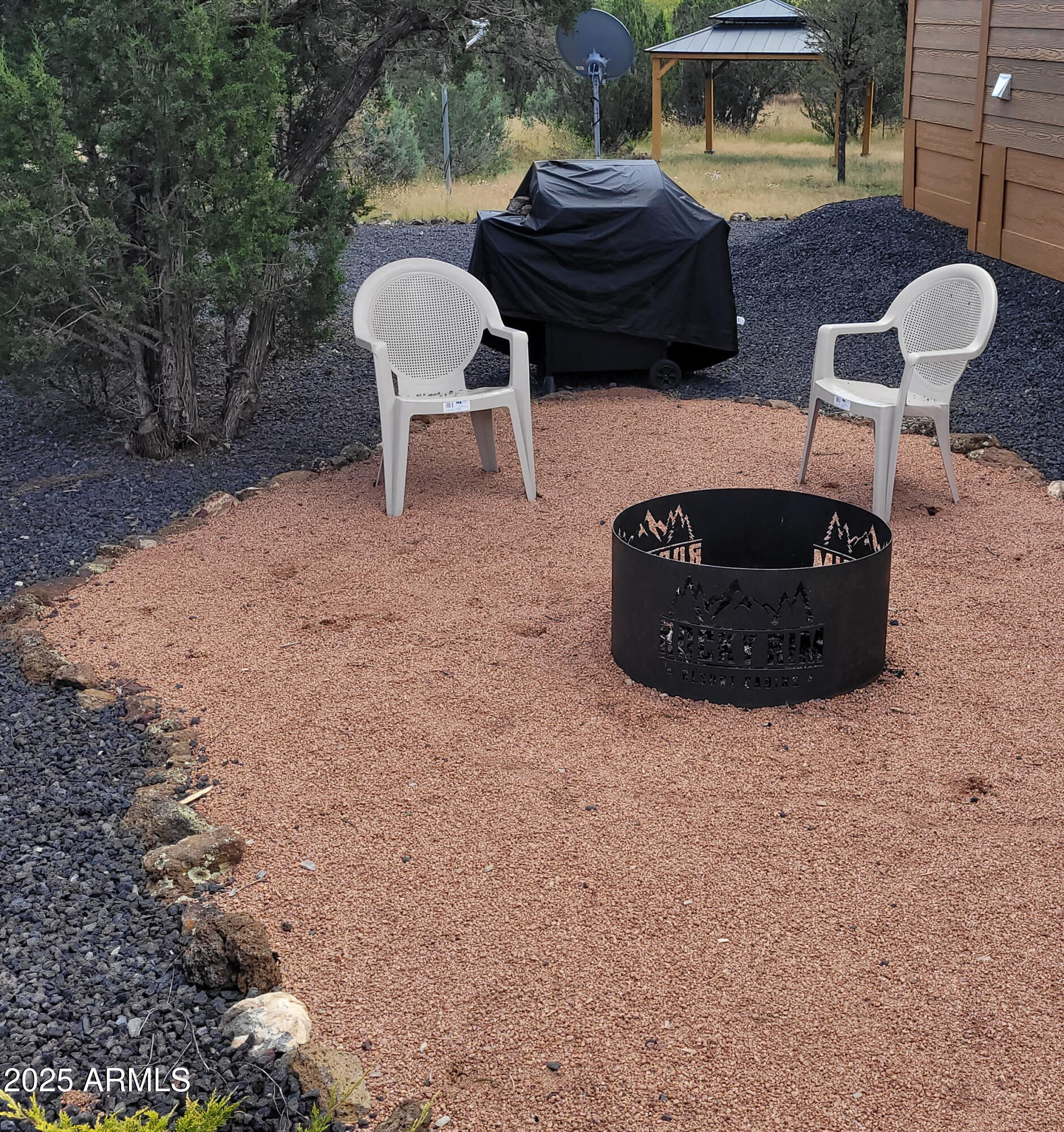 2746 Columbia Lane, Unit 10 Overgaard, AZ 85933 - Photo 30 of 33 a view of a two chairs in a backyard