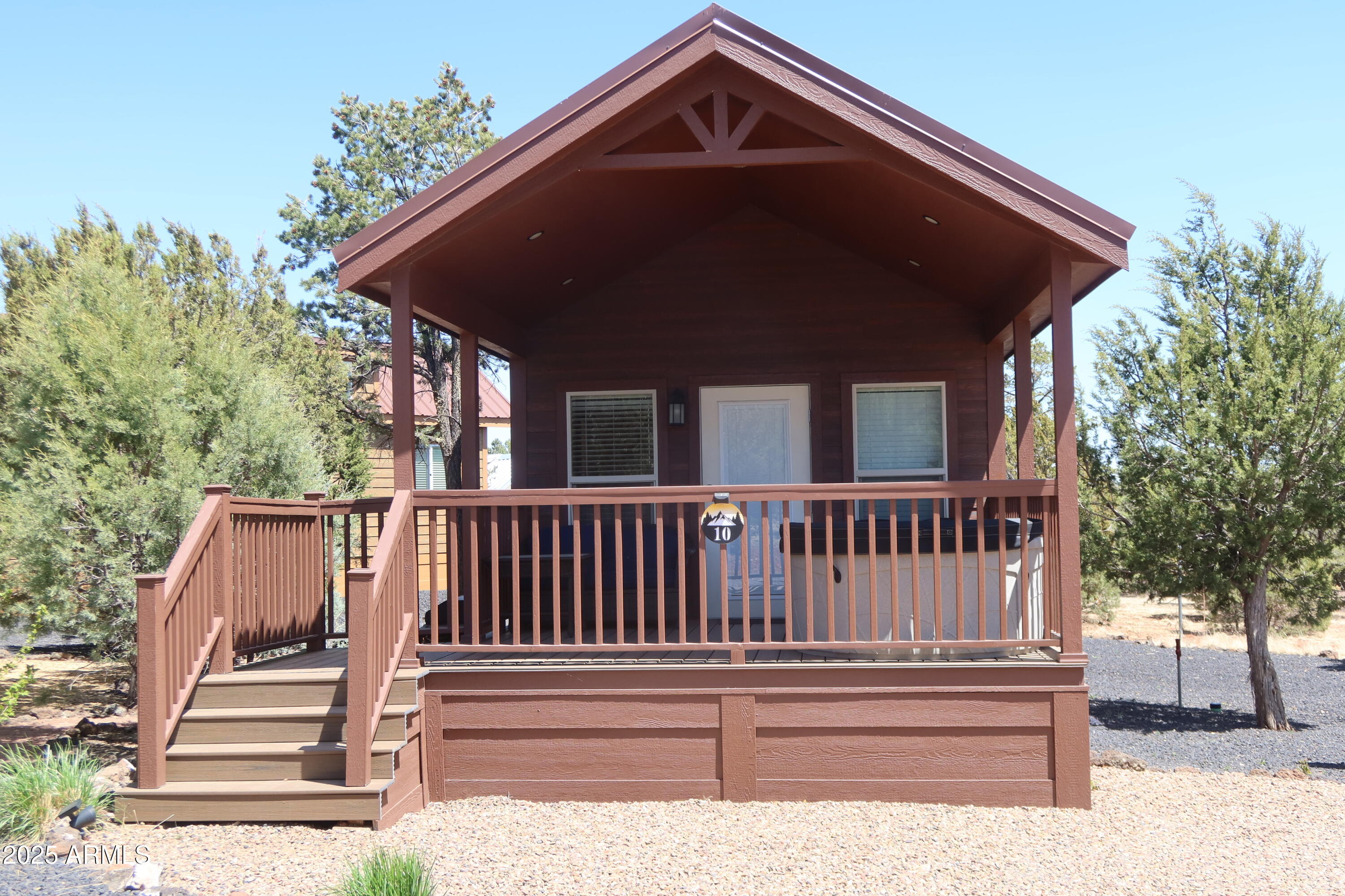 2746 Columbia Lane, Unit 10 Overgaard, AZ 85933 - Photo 7 of 33 a front view of a house with a small yard