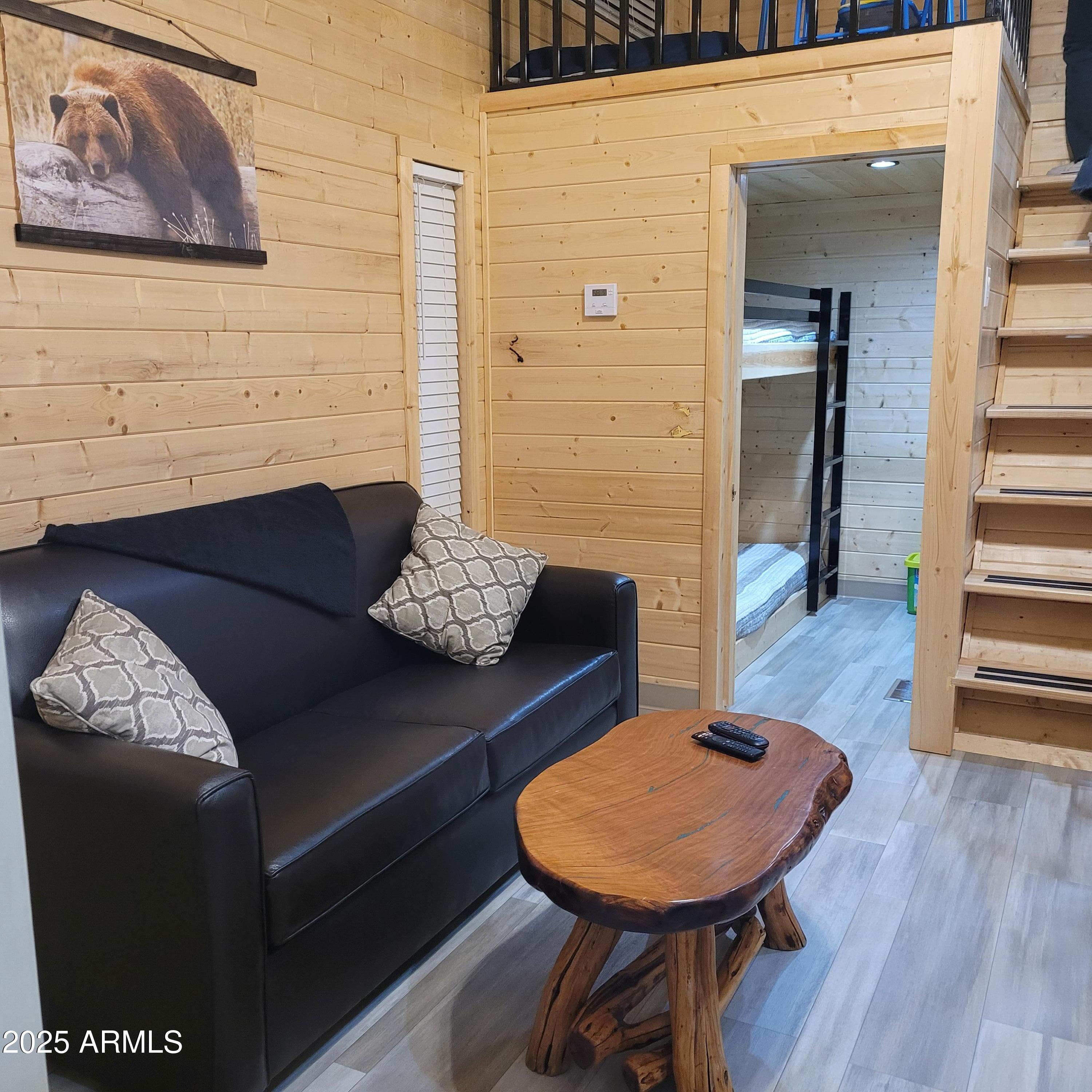 2746 Columbia Lane, Unit 10 Overgaard, AZ 85933 - Photo 10 of 33 a living room with furniture and a wooden floor